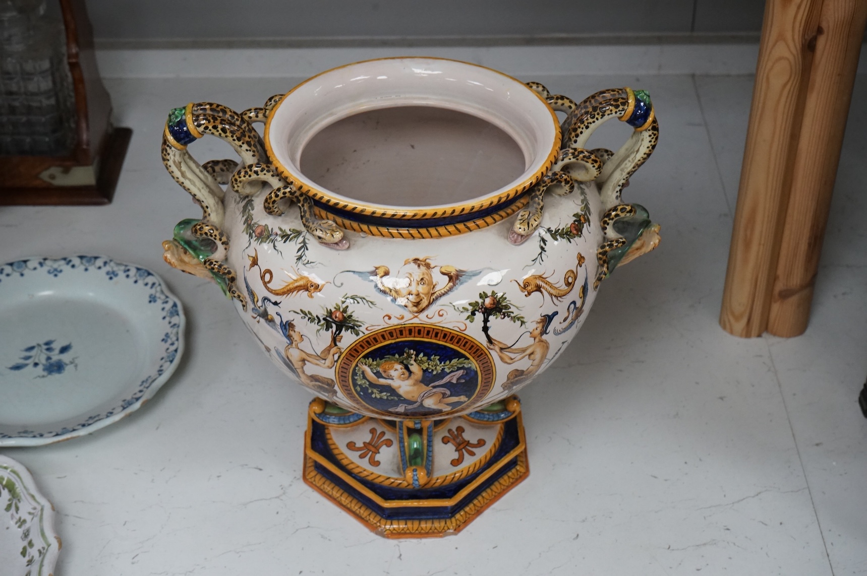 A large Ginori maiolica two handled pedestal vase, 34cm from base to top of handles
